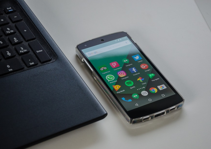 an android phone and a laptop